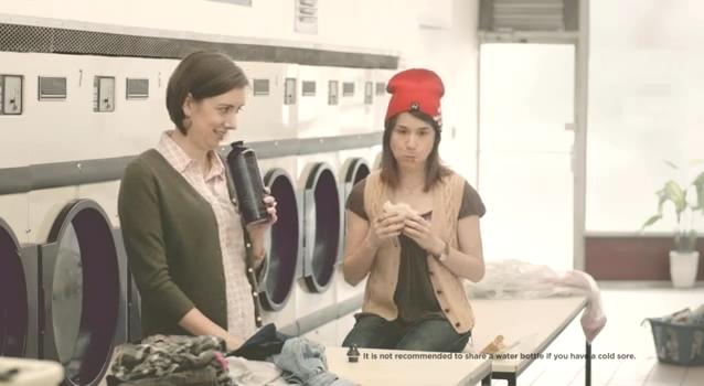 She smells it... SHE SMELLS THE BOTTLE!