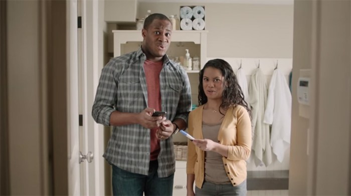 The dad doesn't look to excited with the happy news.