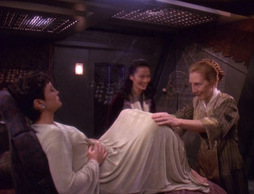 She does become a surrogate mother for a while, but mostly because Nana Visitor was pregnant at the time.